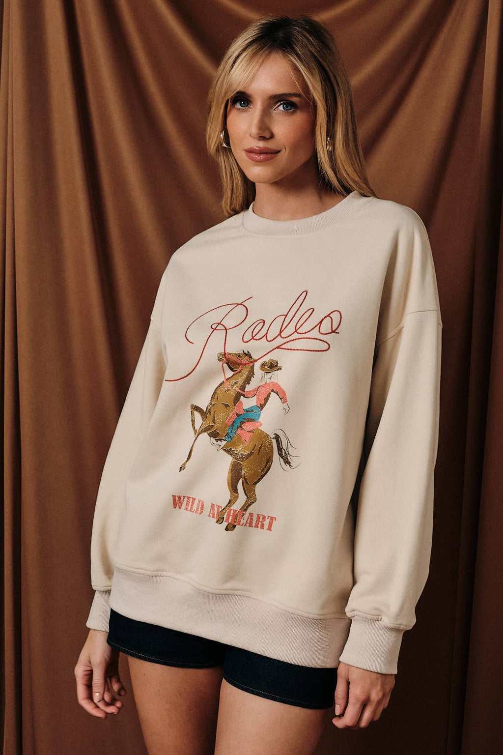 ROUND NECK LONG SLEEVE "RODEO" GRAPHIC SWEATSHIRT