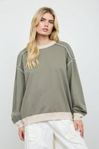 EXPOSED SEAM CONTRAST TRIM KNIT TOP