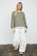 EXPOSED SEAM CONTRAST TRIM KNIT TOP